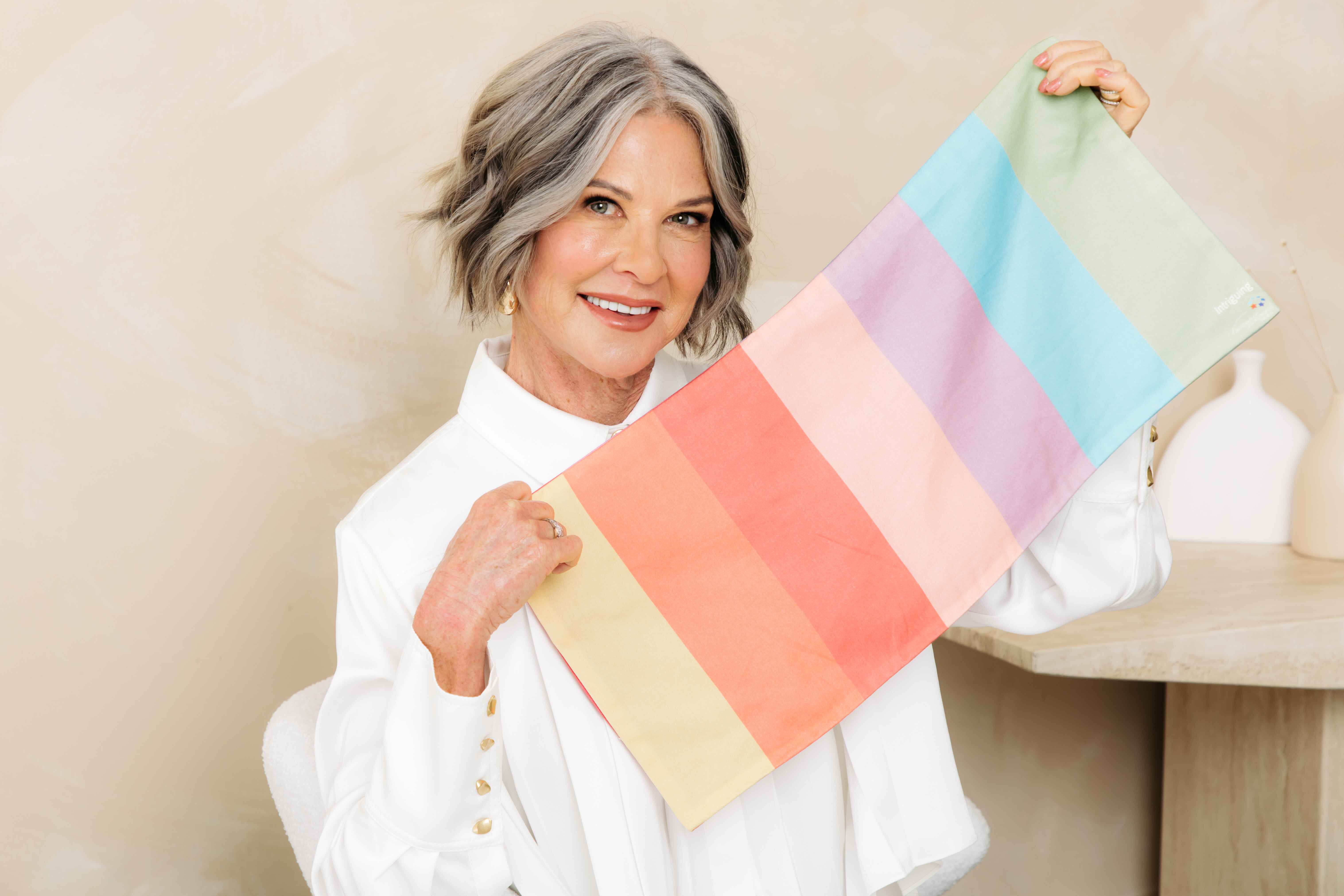 Alison holding up a colour palette for colour analysis